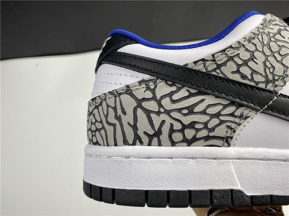 from Supreme × Nike SB Dunk Low “White Cement 304292-001