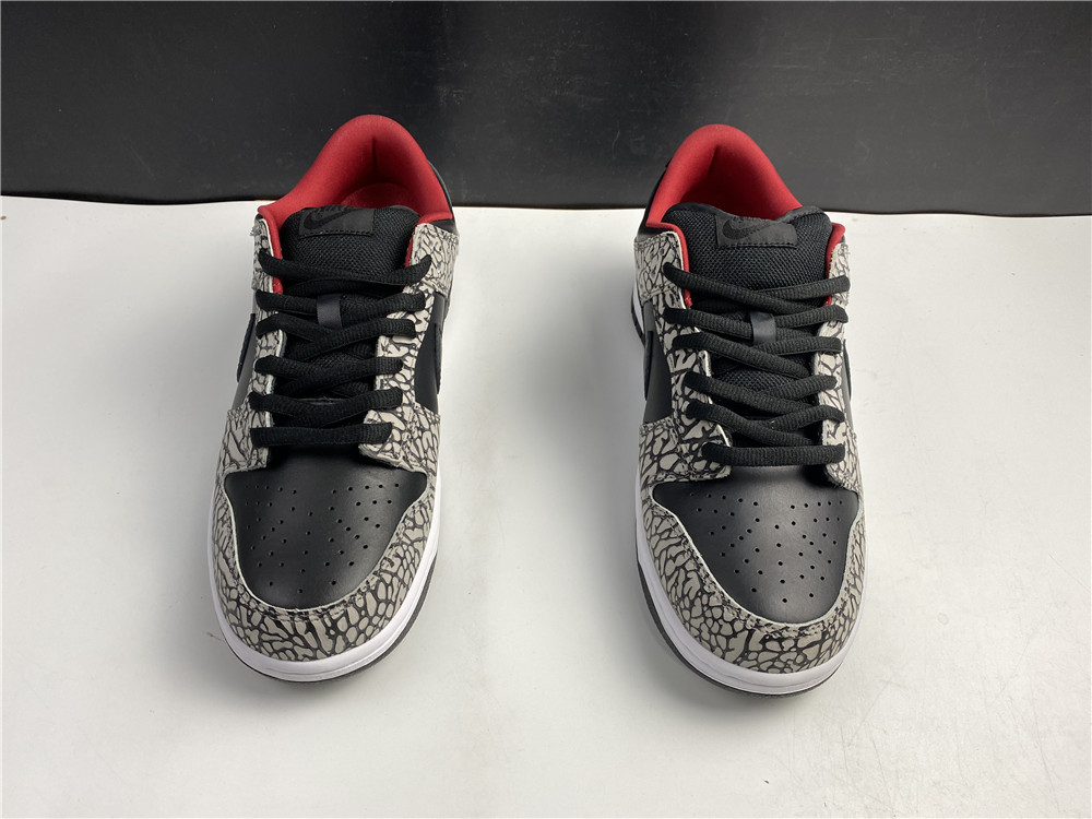from Supreme × Nike SB Dunk Low “Black Cement 304292-131