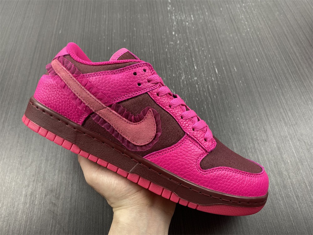 from Nike Spruces Up Its Dunk Low Team Red/Pink DQ9324-600